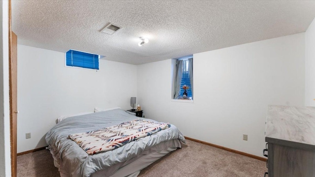 carpeted bedroom with a textured ceiling