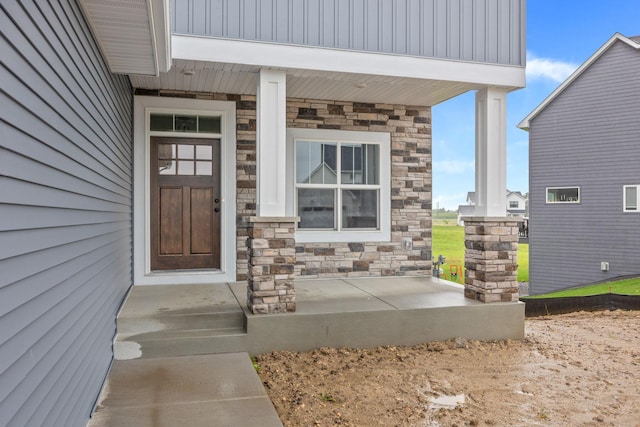 property entrance with covered porch