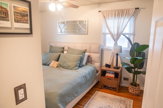 bedroom with hardwood / wood-style floors