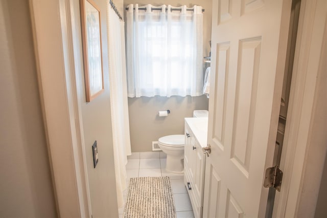 bathroom featuring tile patterned floors, toilet, and vanity