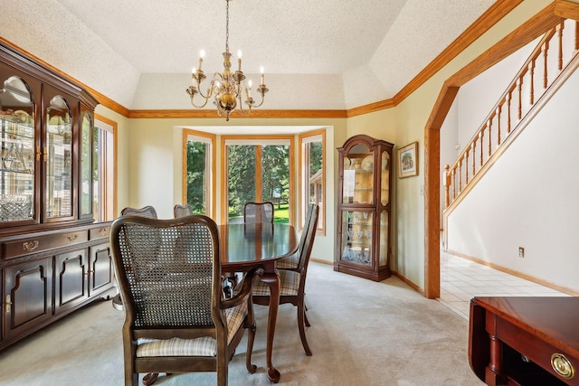 carpeted dining room featuring lofted ceiling, a raised ceiling, a textured ceiling, and a notable chandelier