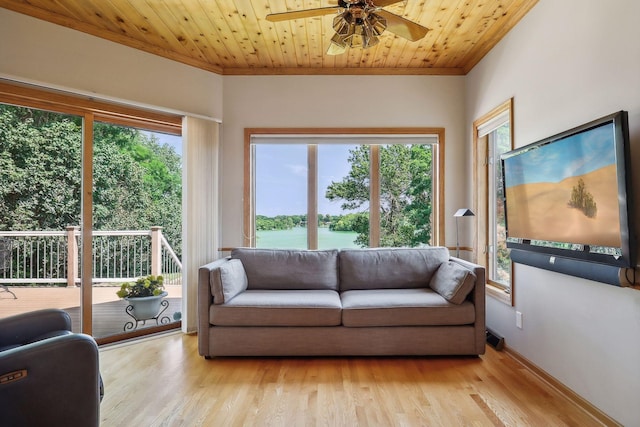 living room with crown molding, wood ceiling, light hardwood / wood-style floors, and ceiling fan