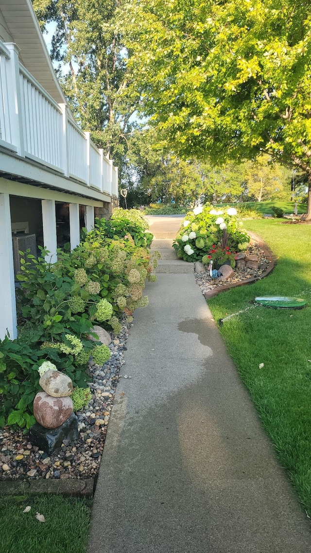 view of home's community with a yard