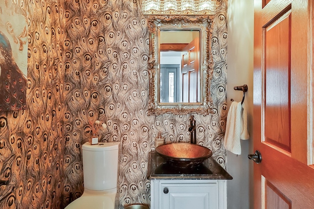 bathroom with vanity and toilet