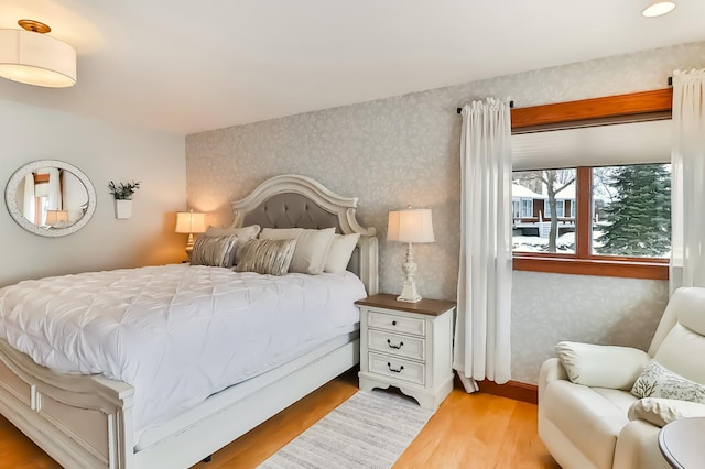 bedroom with light hardwood / wood-style flooring