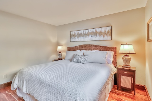 bedroom with light hardwood / wood-style flooring