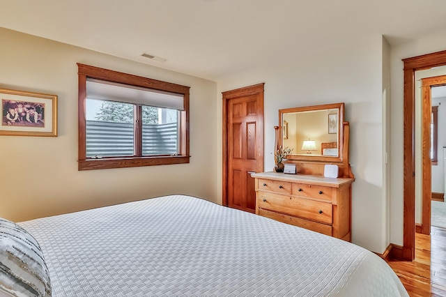 bedroom with light wood-type flooring