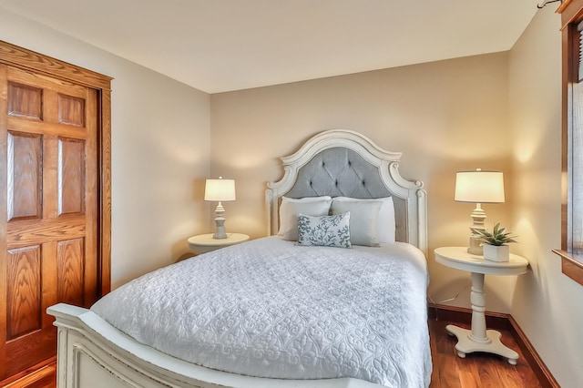 bedroom featuring dark hardwood / wood-style floors