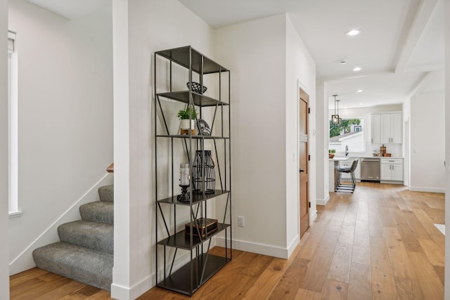 hall with light hardwood / wood-style flooring