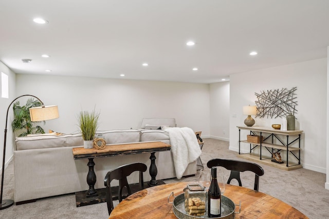 dining room with light carpet