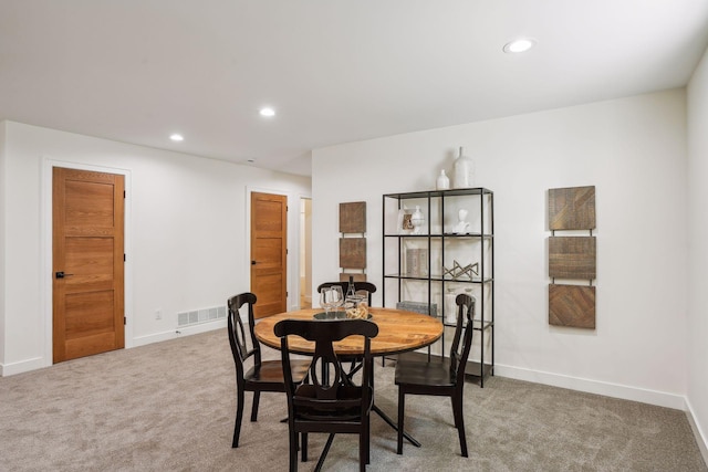 view of carpeted dining area