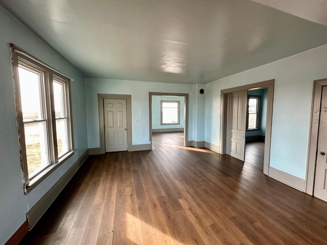 empty room featuring dark hardwood / wood-style flooring