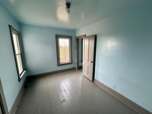 spare room with light hardwood / wood-style floors