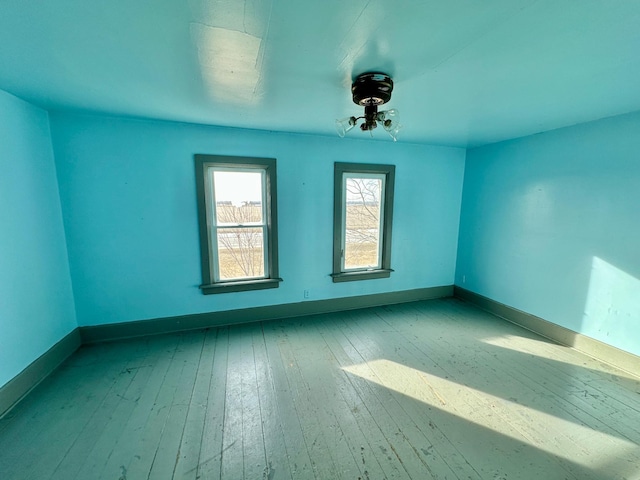 spare room with light hardwood / wood-style flooring