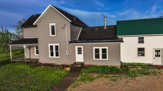 18426 County Road 18, Lewiston, MN 55952 - back of property featuring roof with shingles and a yard