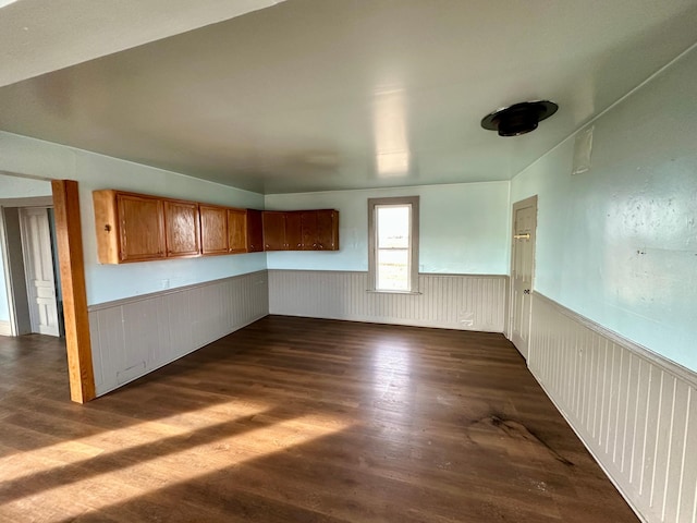 18426 County Road 18, Lewiston, MN 55952 - spare room with dark wood-type flooring and a wainscoted wall