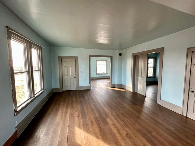 18426 County Road 18, Lewiston, MN 55952 - spare room featuring baseboards and dark wood finished floors