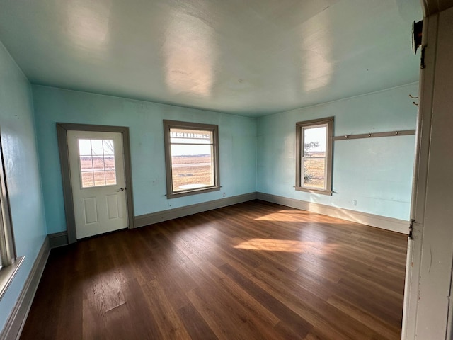 18426 County Road 18, Lewiston, MN 55952 - unfurnished room with dark wood-style floors and baseboards