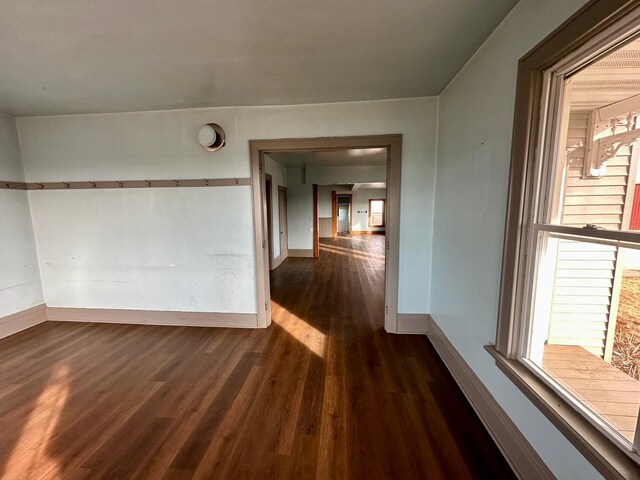 18426 County Road 18, Lewiston, MN 55952 - unfurnished room with baseboards and dark wood-style flooring