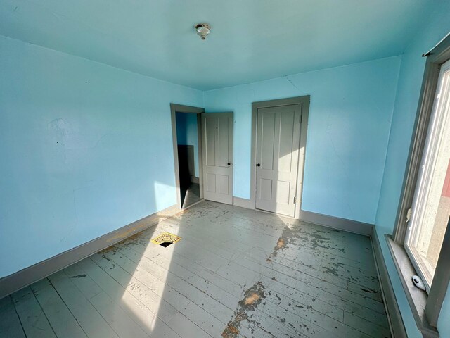 18426 County Road 18, Lewiston, MN 55952 - spare room featuring baseboards and wood finished floors