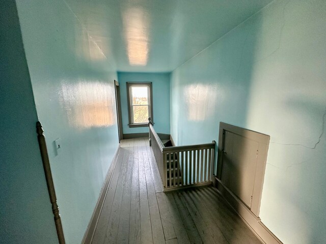 18426 County Road 18, Lewiston, MN 55952 - hallway with an upstairs landing, hardwood / wood-style flooring, and baseboards