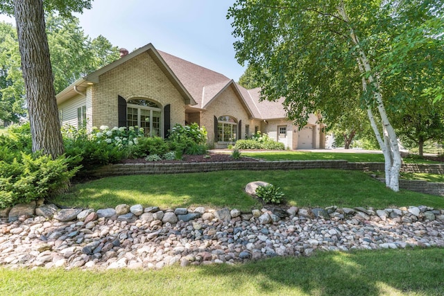 1911 Connell Dr, Fergus Falls, MN 56537 - view of front of home featuring a garage and a front lawn