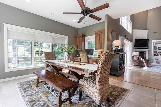 dining space featuring light tile patterned floors and ceiling fan