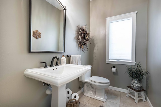 bathroom featuring tile patterned flooring, sink, and toilet