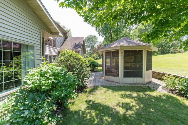 view of yard featuring a sunroom