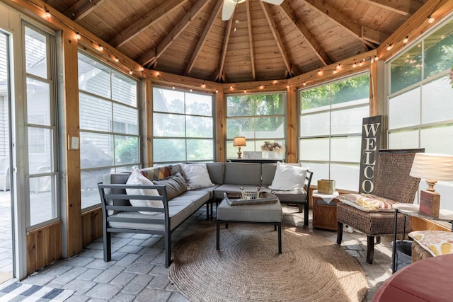 sunroom / solarium featuring vaulted ceiling with beams, wooden ceiling, and a healthy amount of sunlight