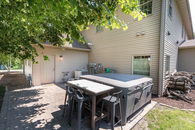 view of patio with a hot tub