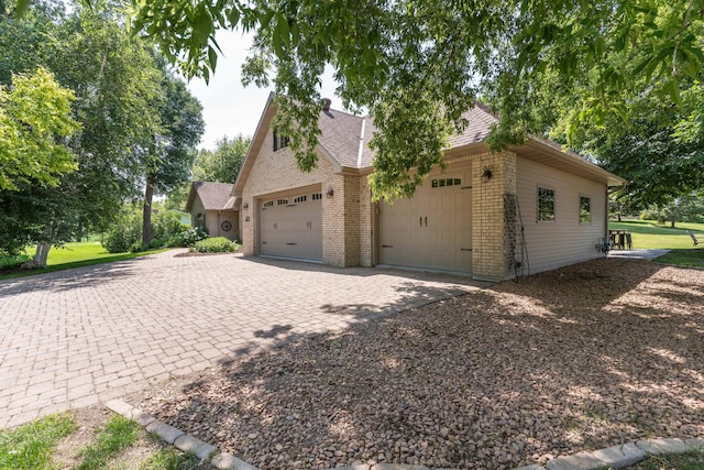 view of side of property featuring a garage