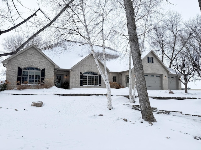 french country home featuring a garage