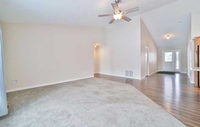 unfurnished room featuring dark wood-type flooring, ceiling fan, and high vaulted ceiling