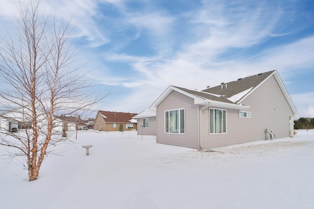 view of snow covered property