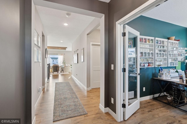 hall with light wood-type flooring