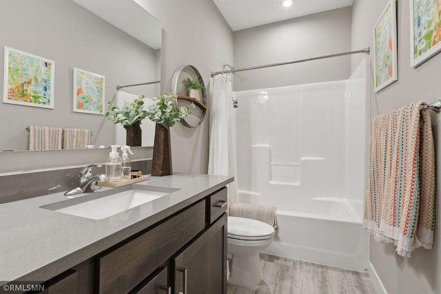 full bathroom featuring shower / bath combination with curtain, vanity, toilet, and hardwood / wood-style flooring