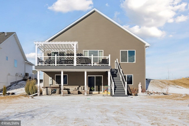 back of house with a pergola