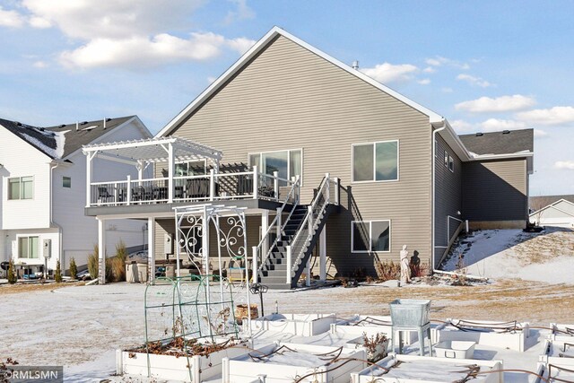 snow covered house with a pergola