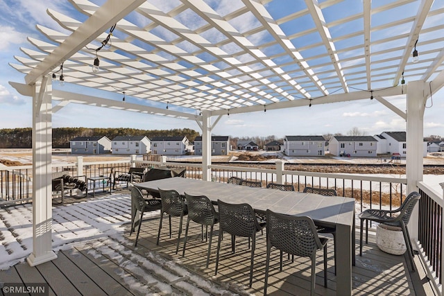 deck with an outdoor bar and a pergola