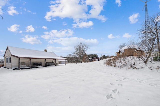 view of yard layered in snow