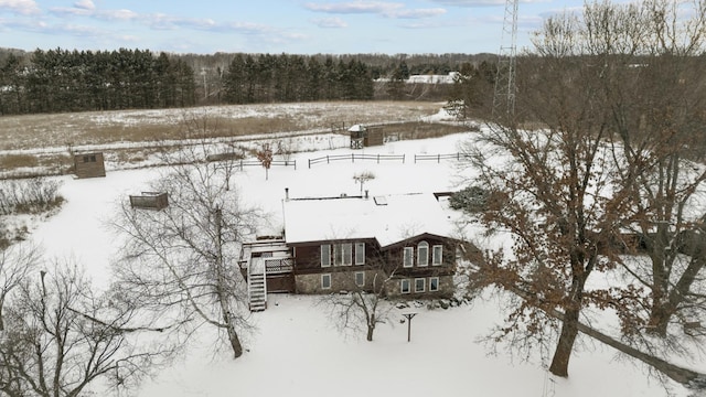 snowy aerial view with a forest view