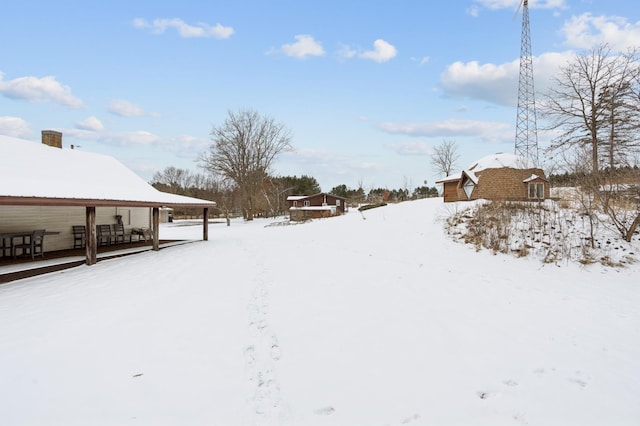 view of yard covered in snow