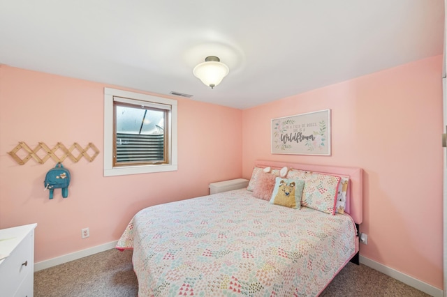 bedroom with carpet floors, visible vents, and baseboards