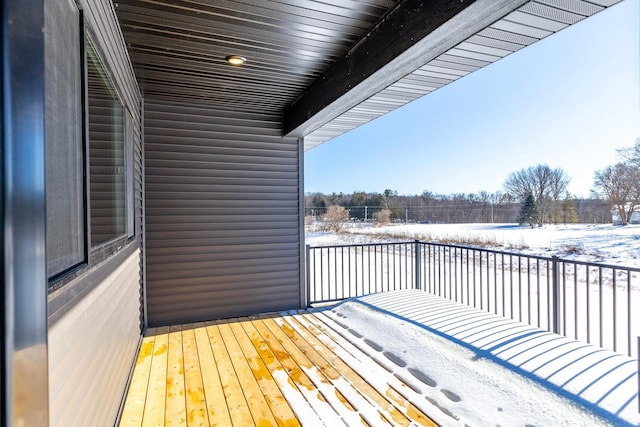 view of snow covered deck