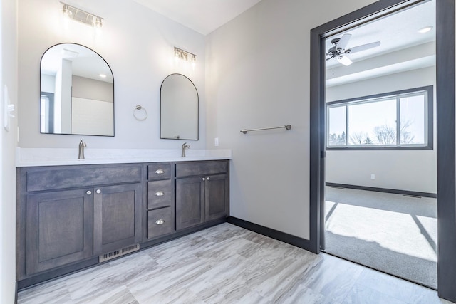 bathroom featuring vanity and ceiling fan