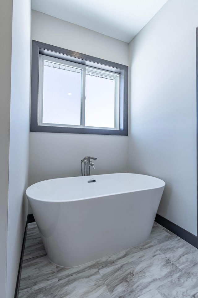 bathroom featuring a washtub