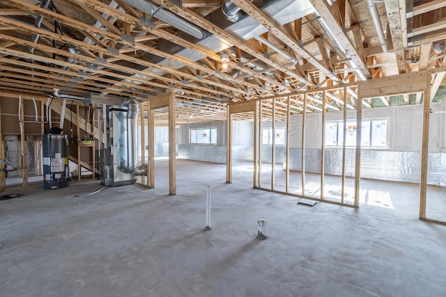 basement featuring heating unit and gas water heater