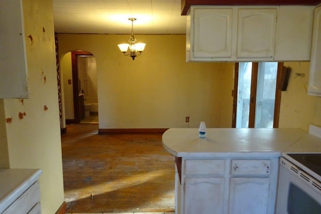 kitchen featuring pendant lighting, an inviting chandelier, light hardwood / wood-style flooring, and white cabinets