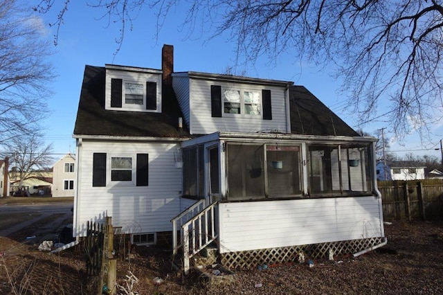 back of property featuring a sunroom